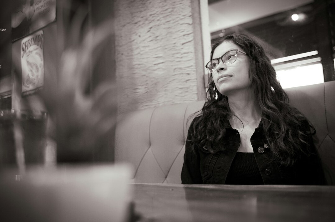 businesswoman listening in meeting