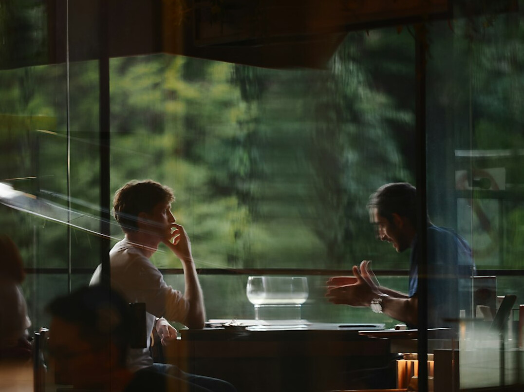 business executives negotiating at table